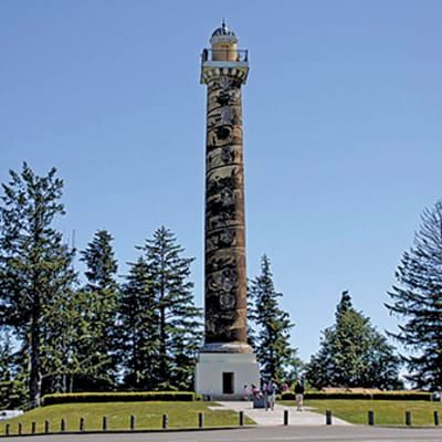 A tall tower with a clock on top of it