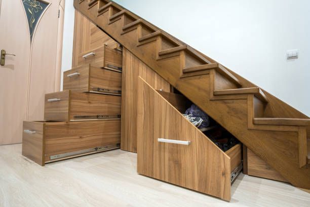 Custom wooden under stair storage drawers with built in cabinetry for saving organization design bin.
