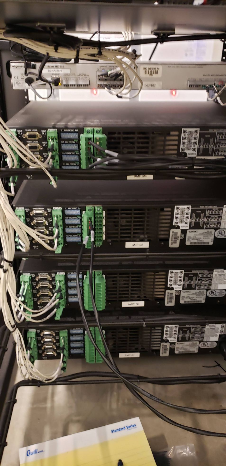 A row of servers stacked on top of each other in a server room.