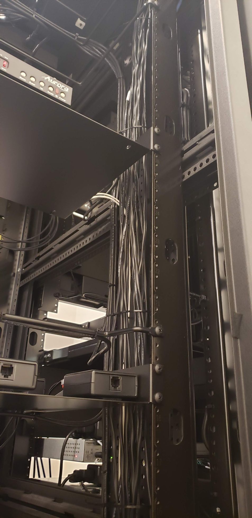 A black and white photo of a large metal structure in a building.