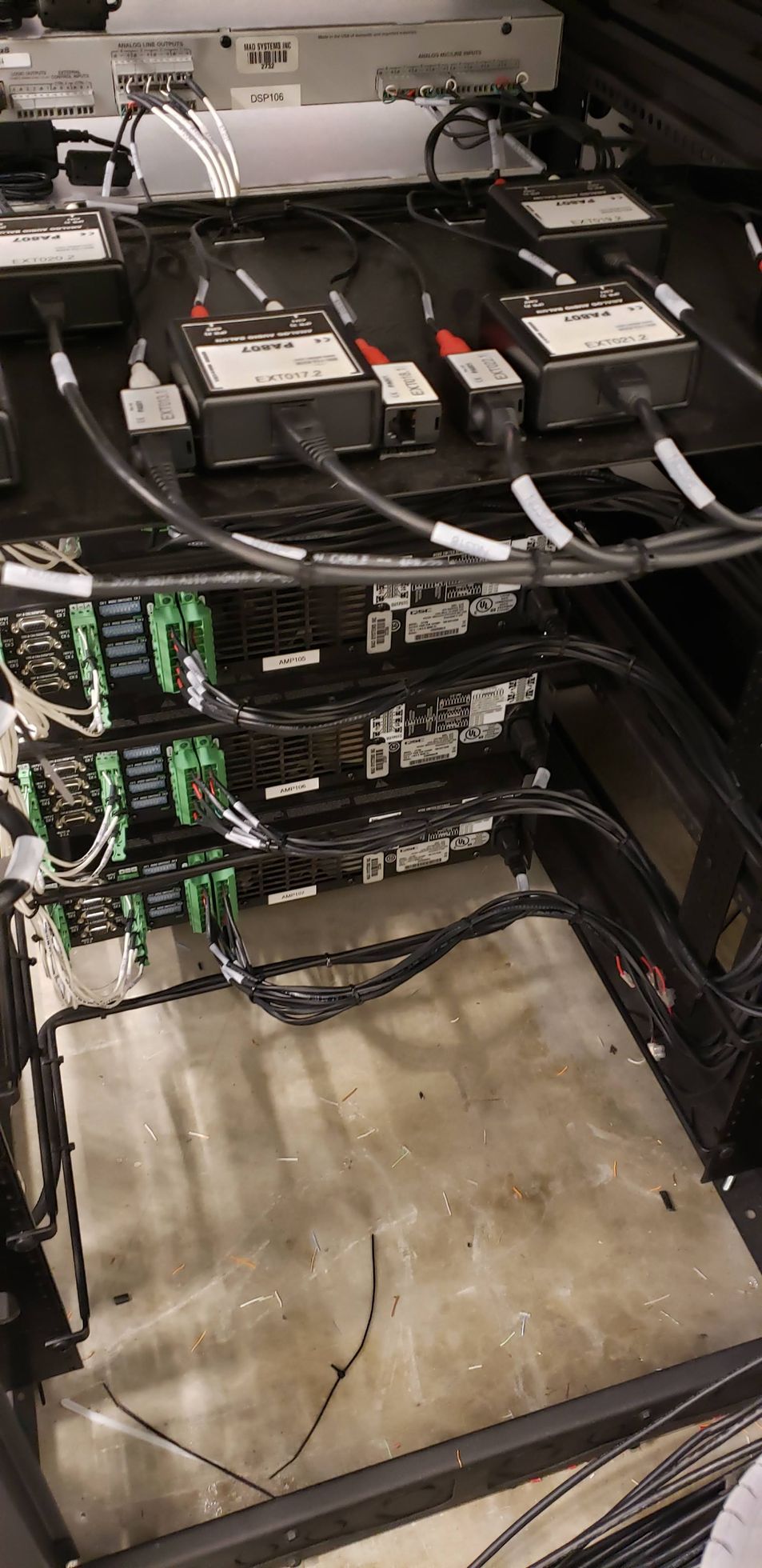 A bunch of wires are connected to a server rack.