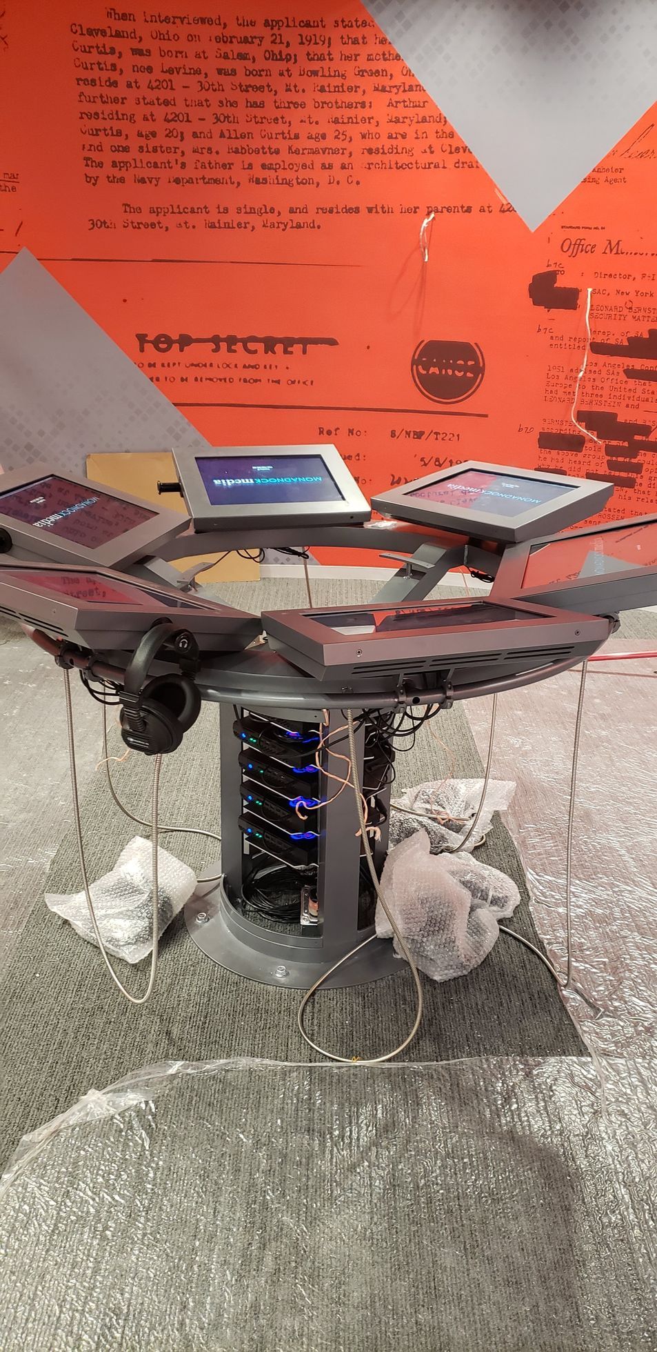 A table with a bunch of electronic devices on it.