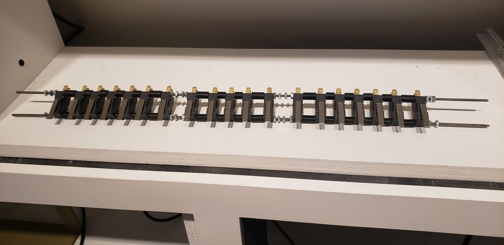 A train track is sitting on top of a white table.