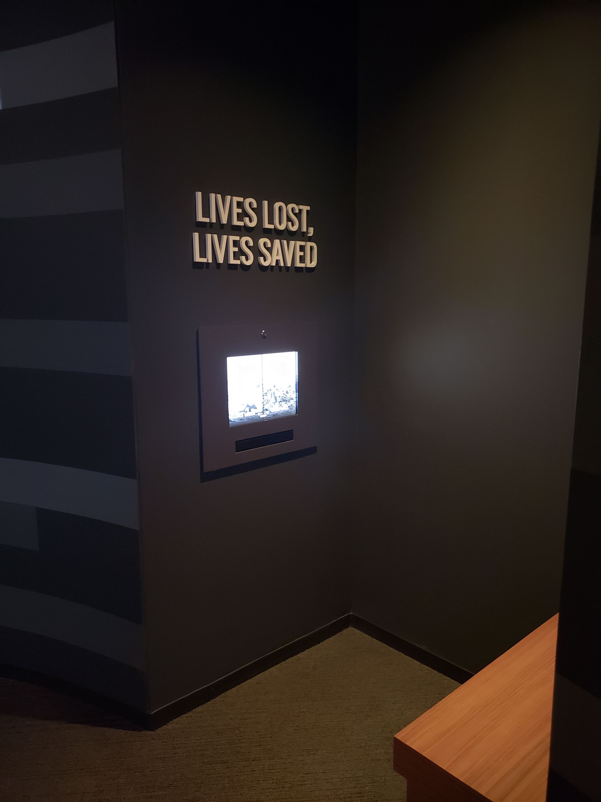 A sign on a wall that says lives lost lives saved