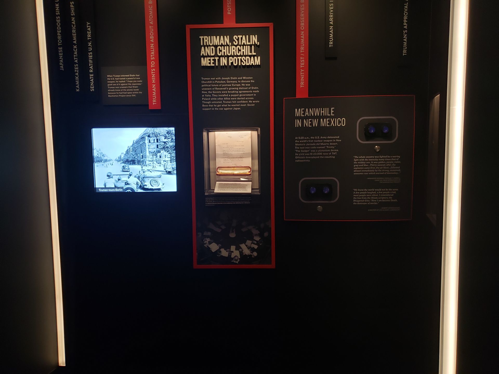 A black wall with a sign that says 