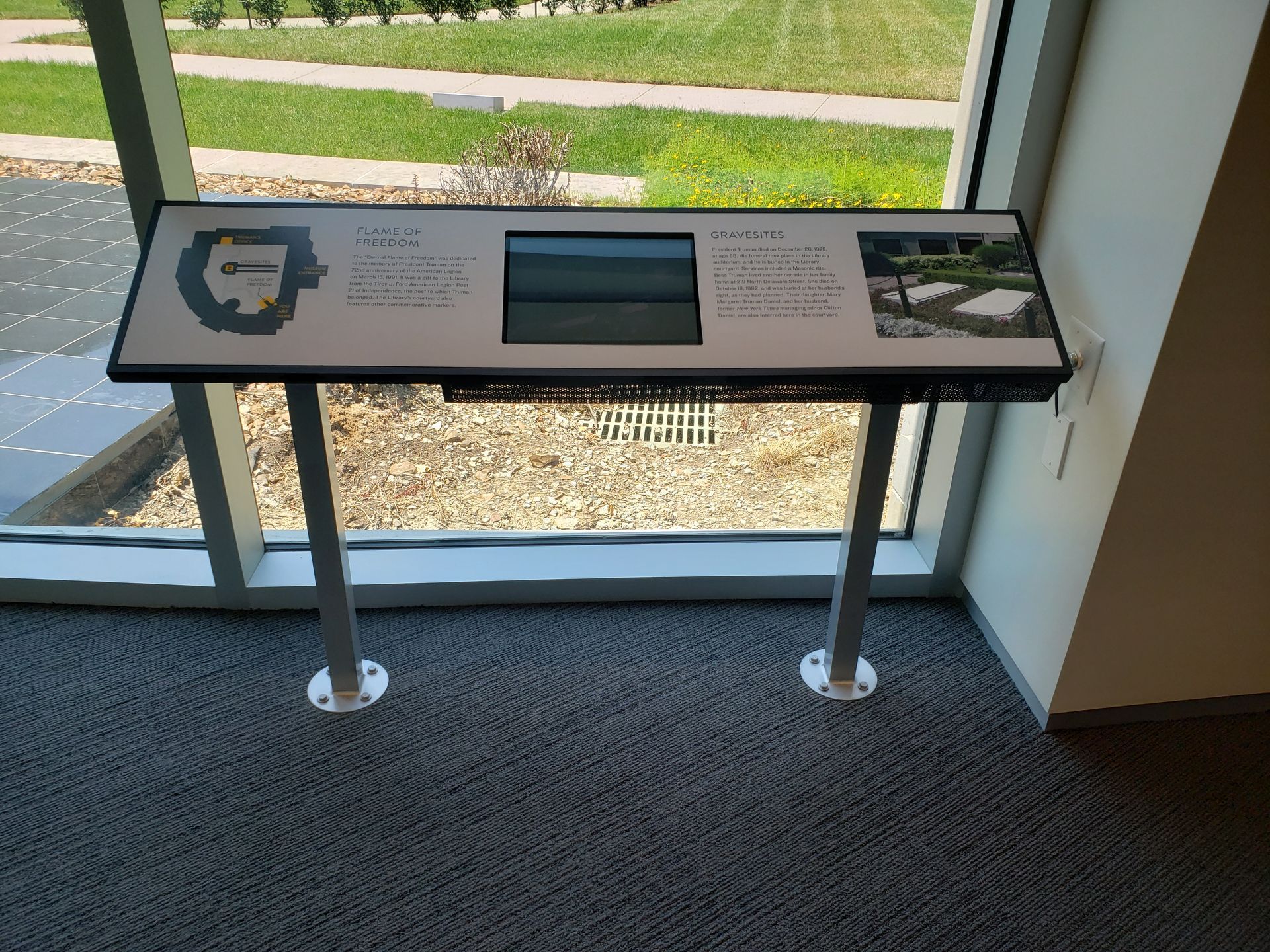 A large window with a sign in front of it