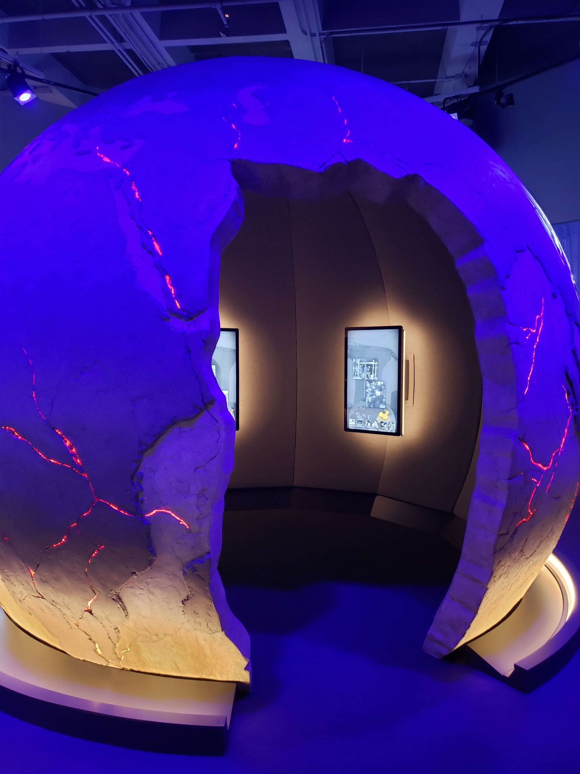 A room with a globe in the middle of it