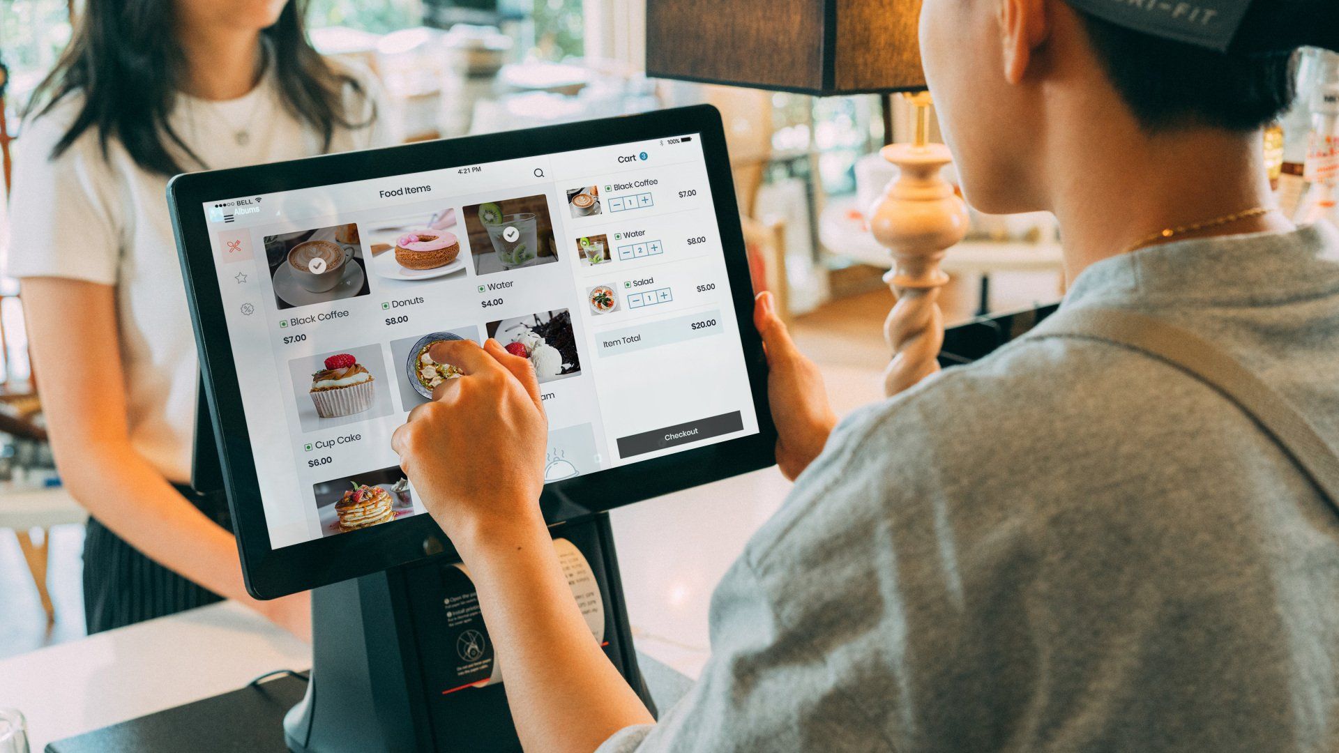 A man is working on a server with a screwdriver.