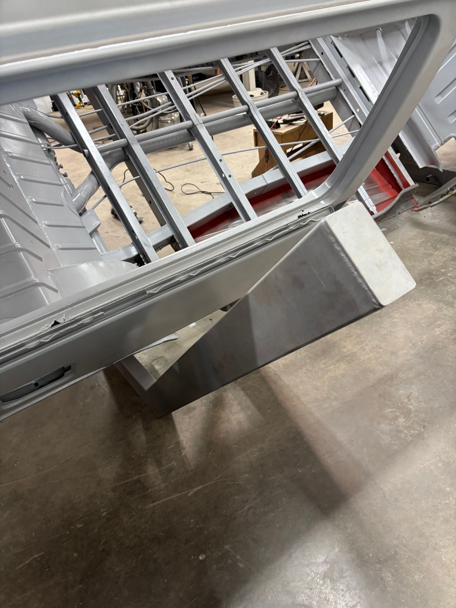Metal staircase railing and steps viewed from above in an indoor industrial setting