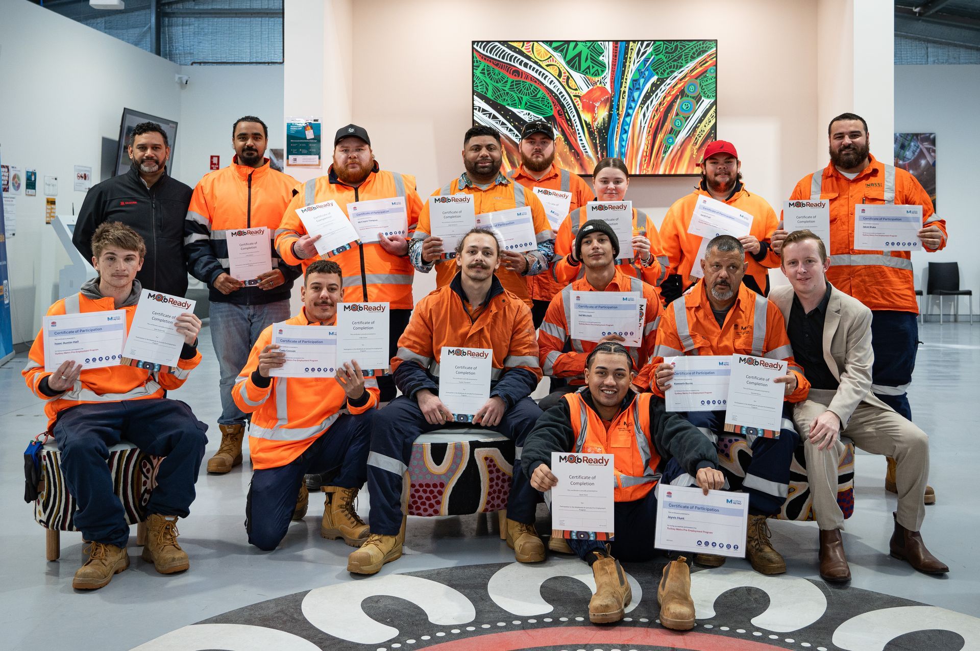 A man in a yellow shirt is holding a bag of candy