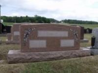 A cemetery with a lot of graves in it