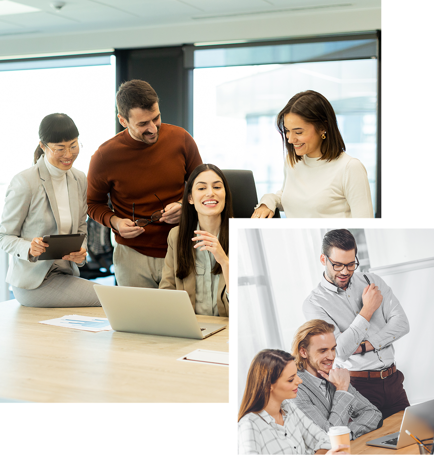 A group of people are sitting around a table with laptops.