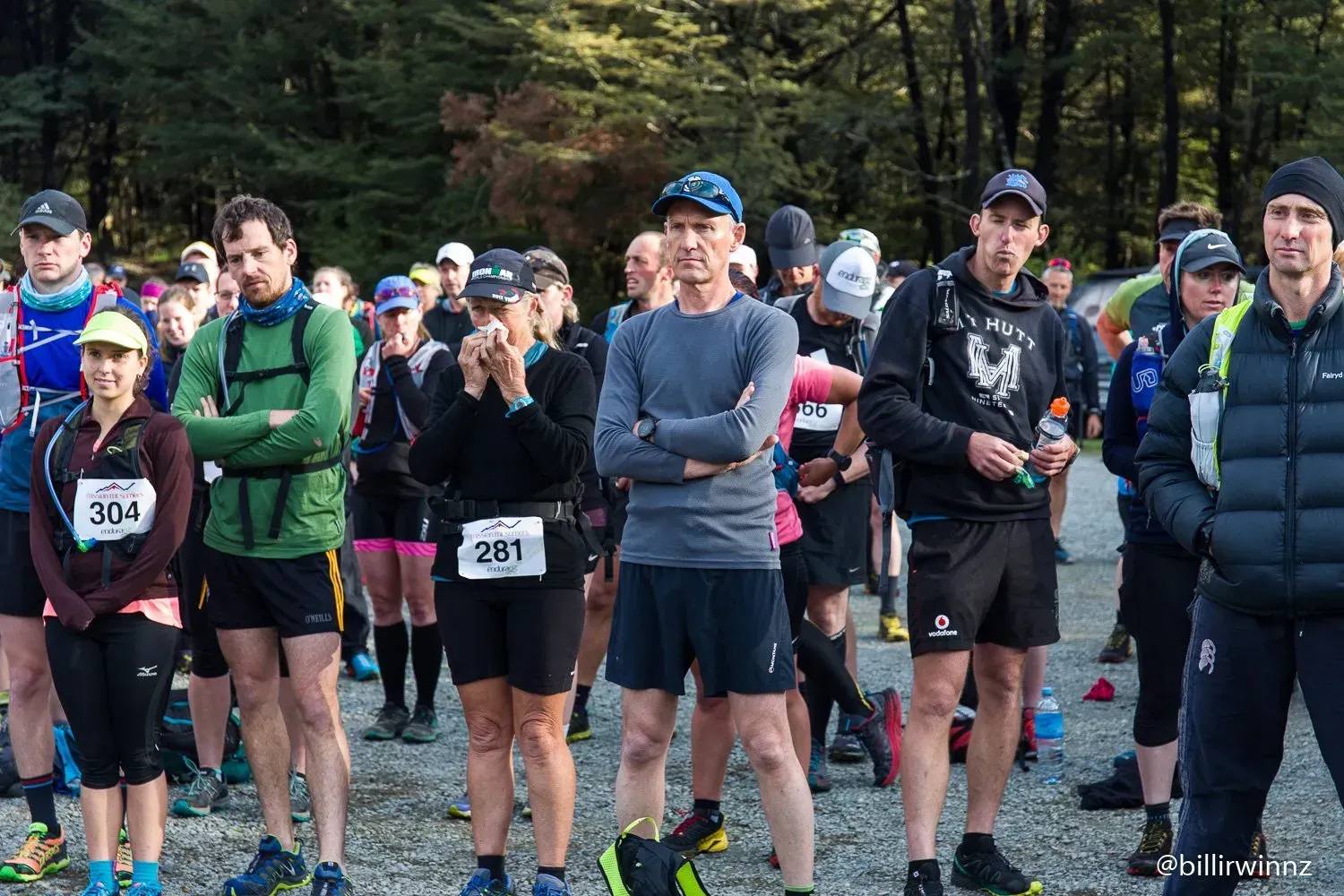A group of people are standing in a line at a race.