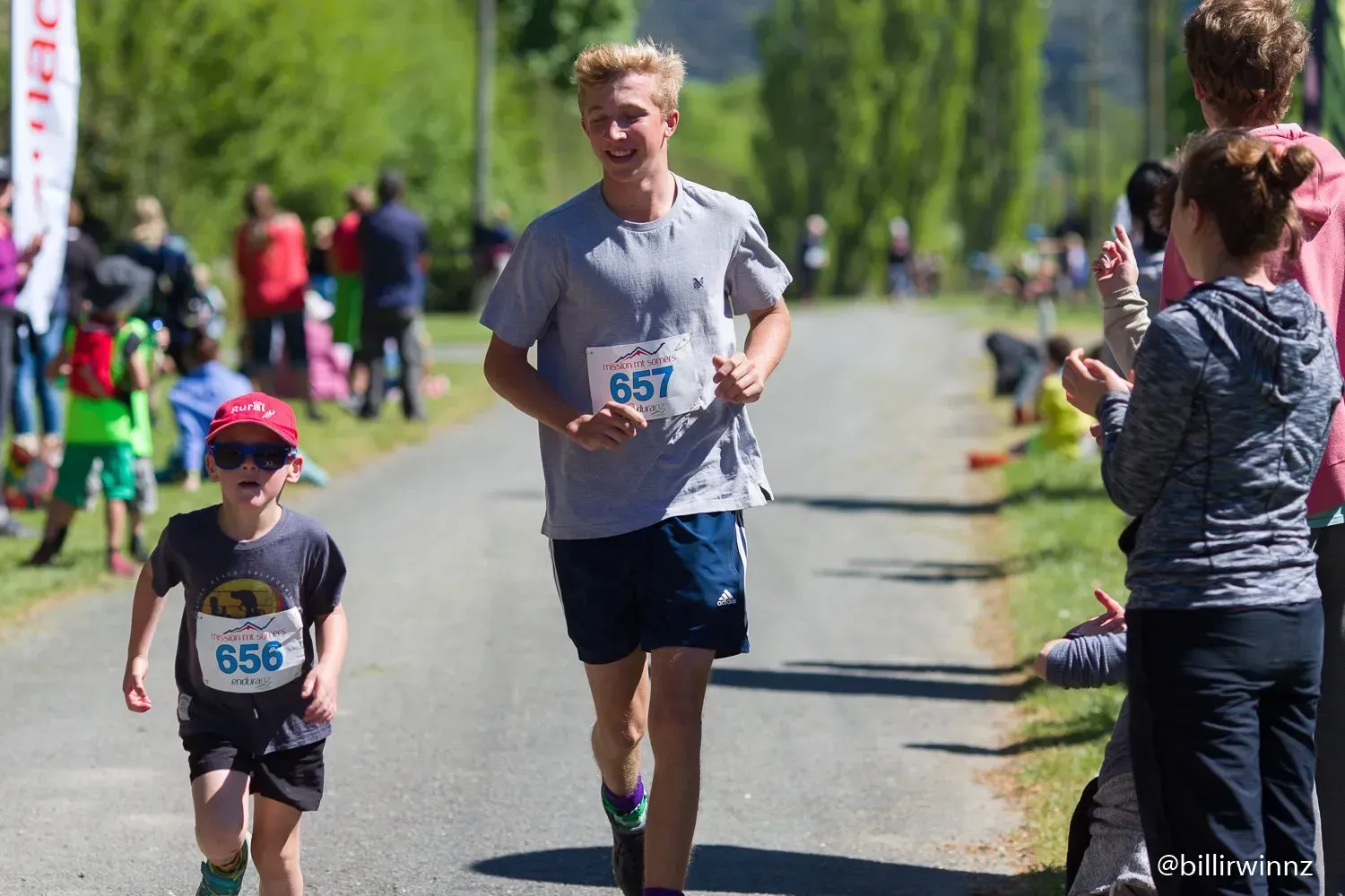 A man and a boy are running in a race.
