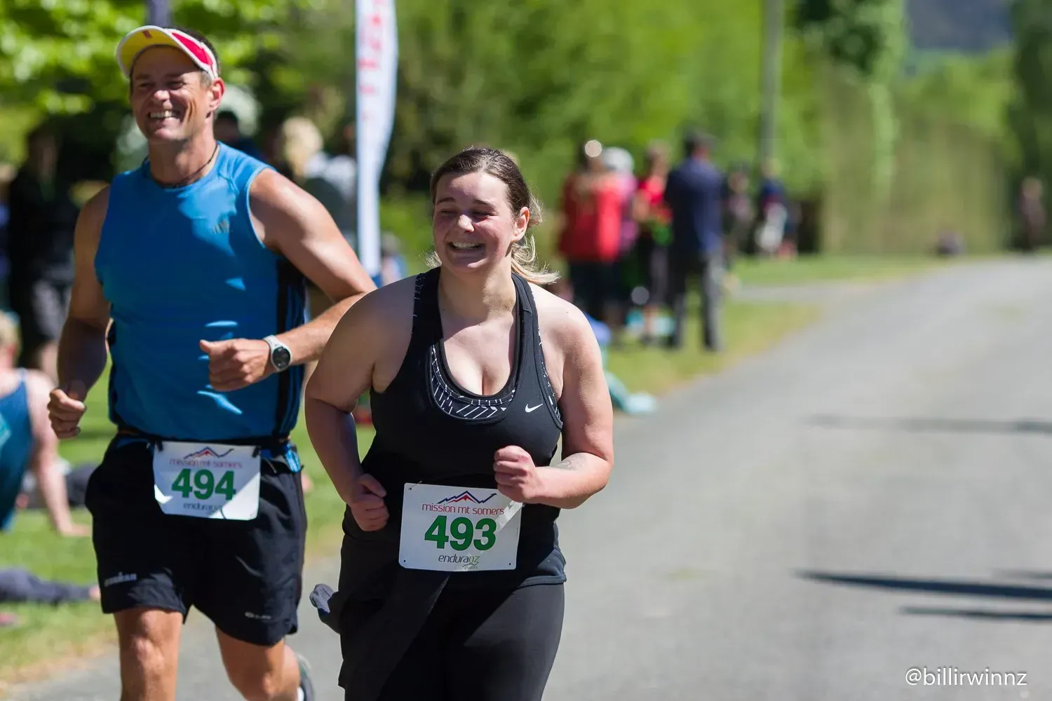 A man and a woman are running in a race.