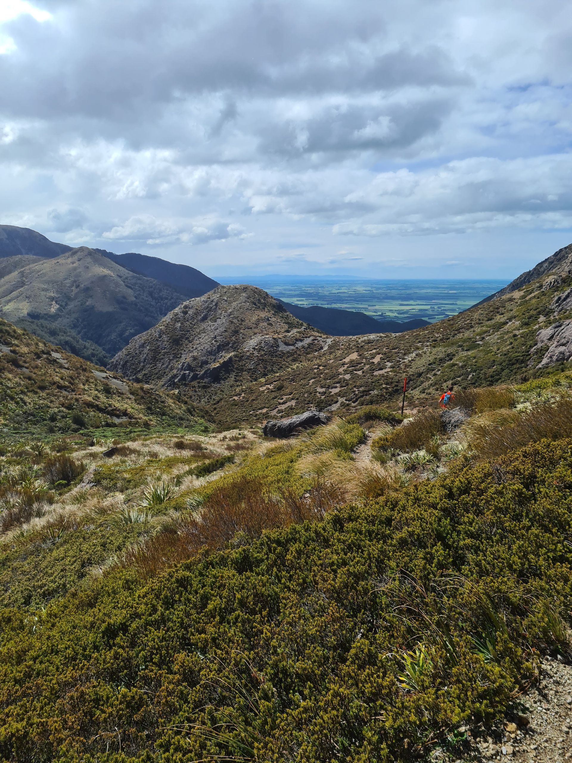 A view of a valley from the top of a mountain.