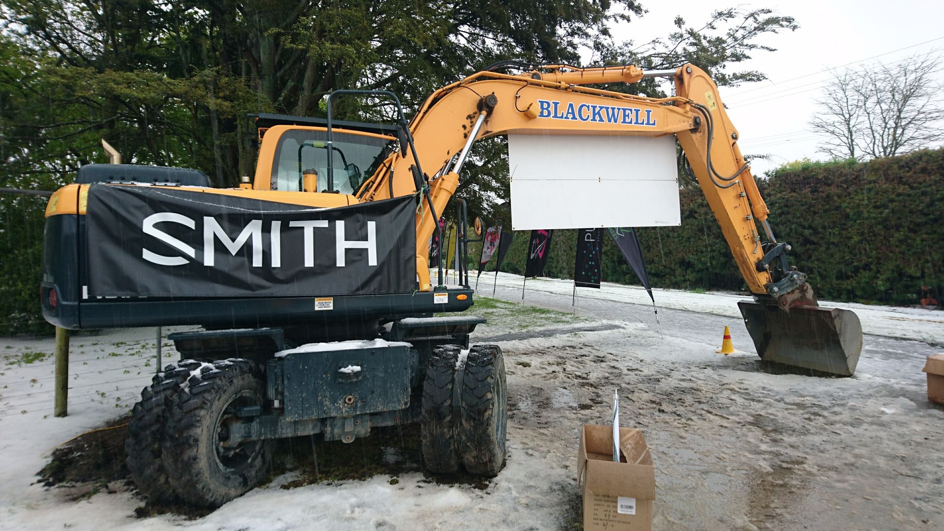 A smith excavator is parked in the snow