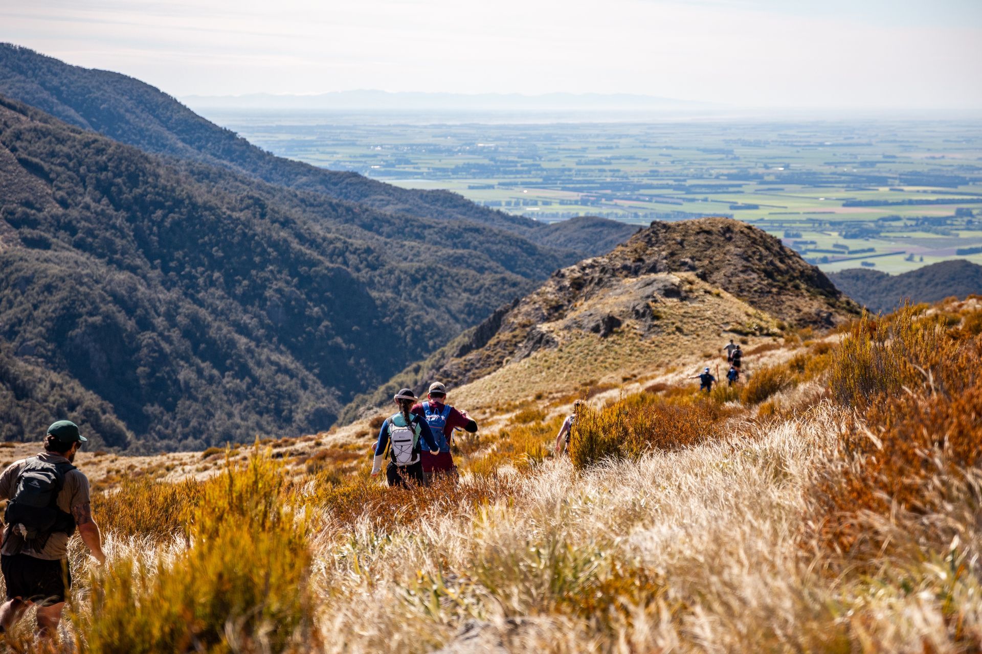 A group of people are hiking up a mountain.