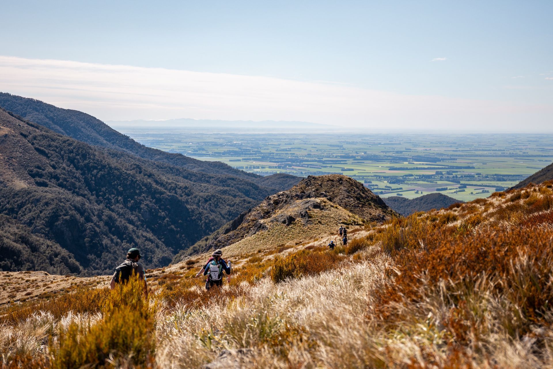 A group of people are hiking up a mountain.