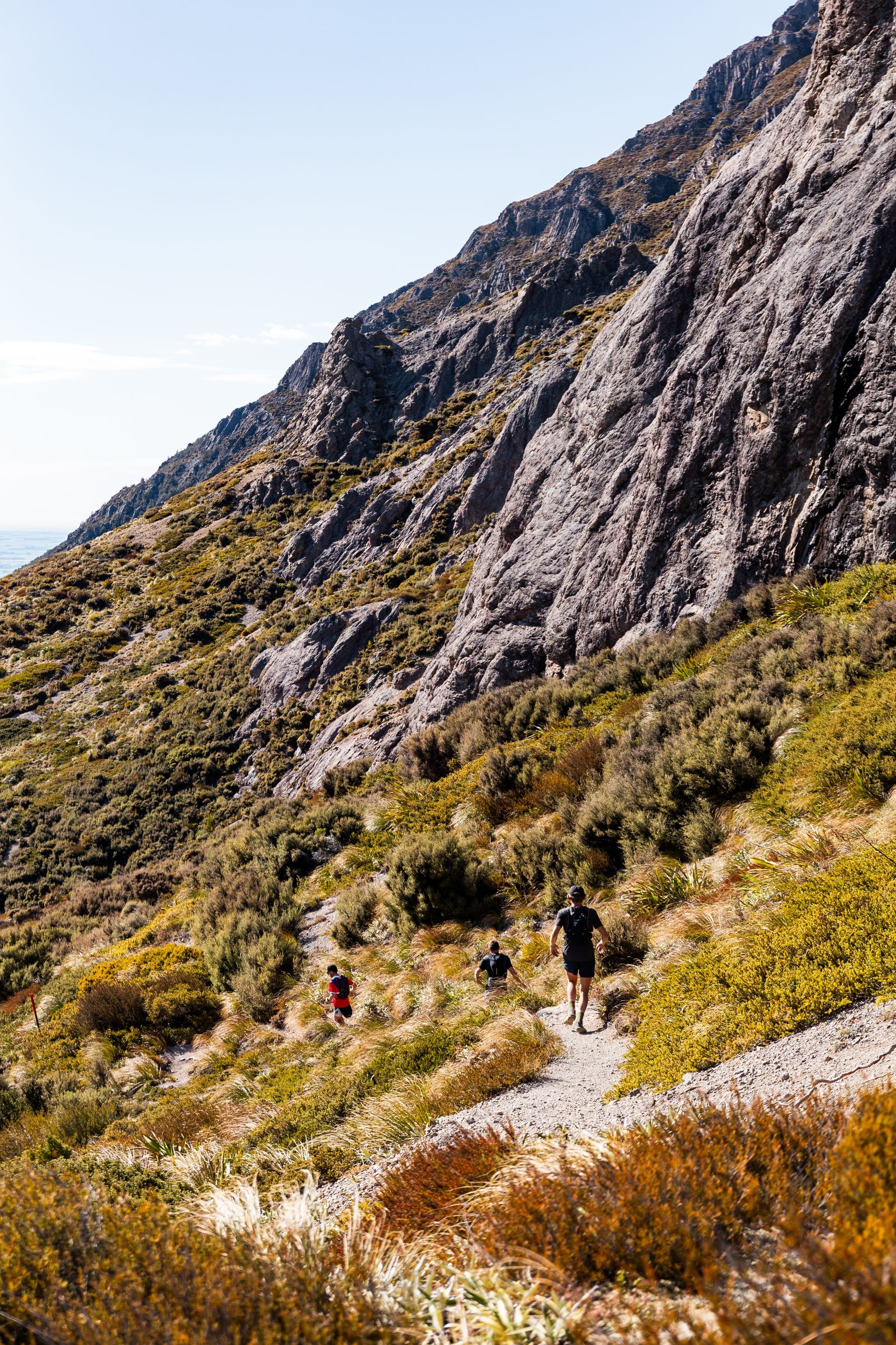 A group of people are hiking up a mountain.