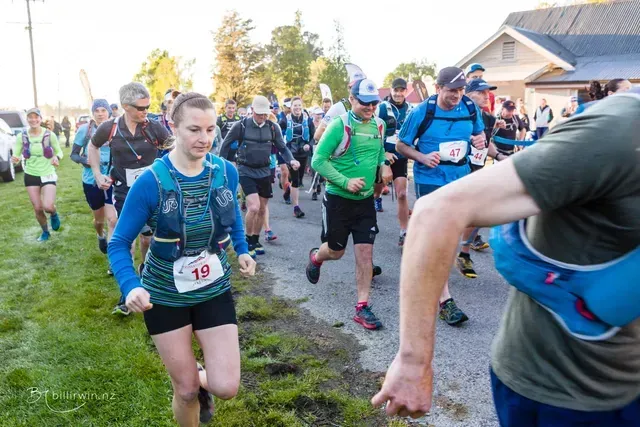 A group of people are running in a race.