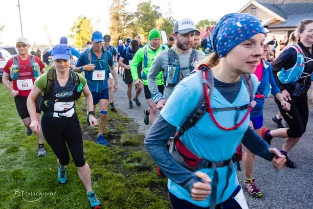 A group of people are running in a race.