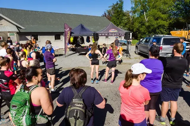 A group of people are standing in front of a building.