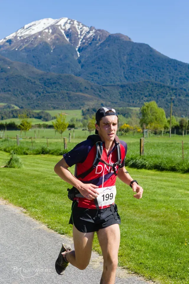 A man running with a number 199 on his shirt