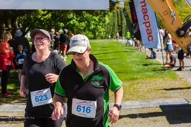 A man and a woman are running in a race.