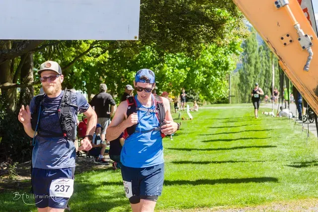 A group of people are running in a park.