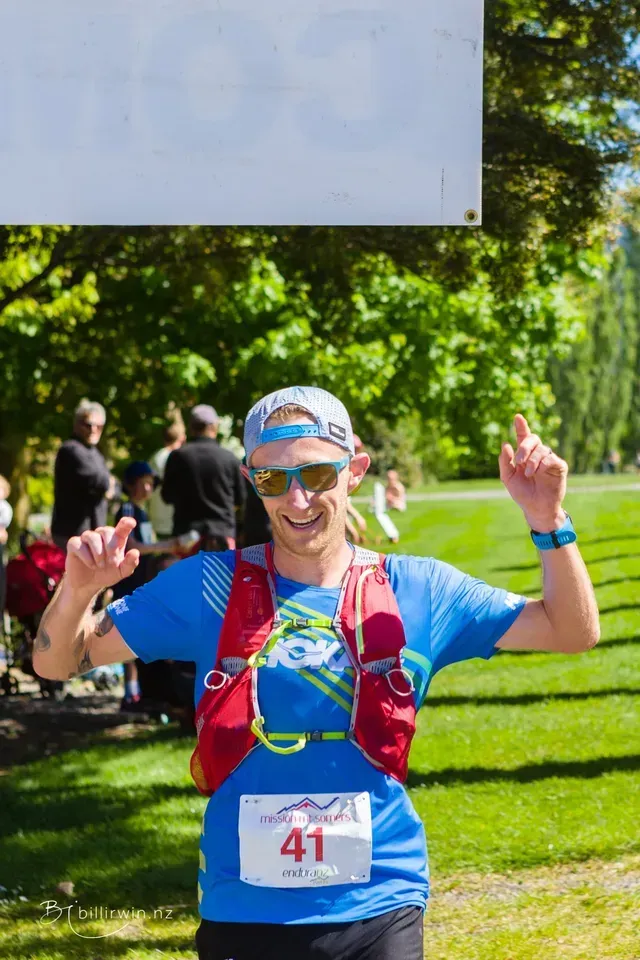 A man is wearing a blue shirt with the number 41 on it.