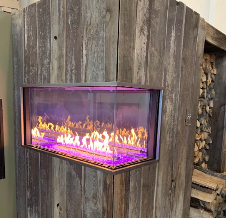 A fireplace with purple flames coming out of it