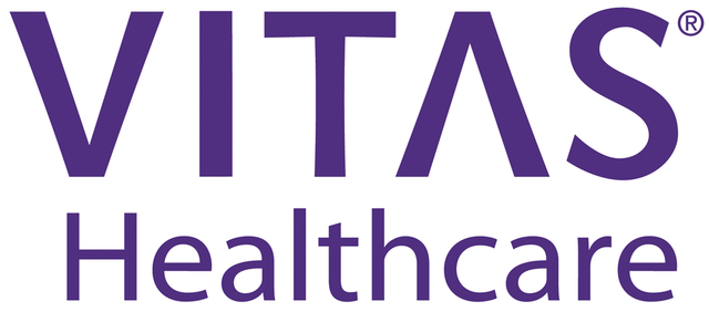 The vitas healthcare logo is purple and white on a white background.