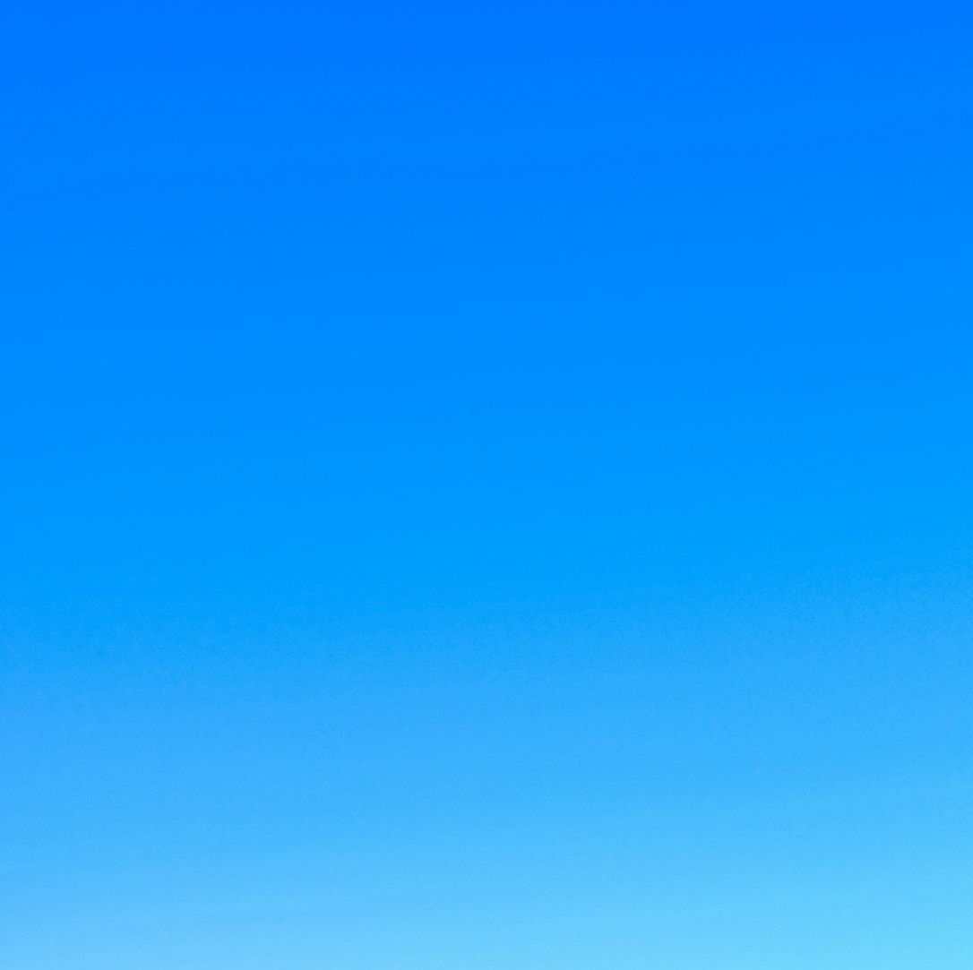 A blue sky with no clouds in it