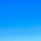 A blue sky with no clouds in it