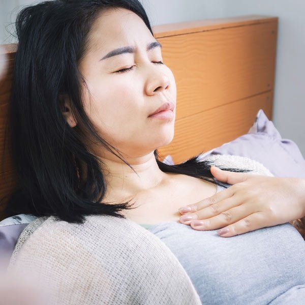 Asian Woman with Acid Reflux