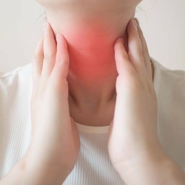 Woman with enlarged thyroid from Graves' Disease