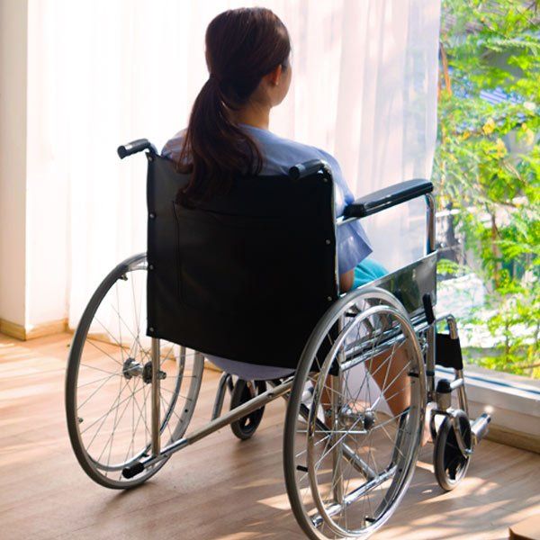 Woman in wheel chair suffering from Multiple Sclerosis