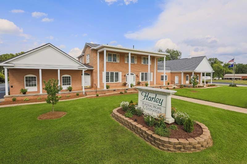 Honey Funeral Home and Cremation Services building with sign and landscaping.