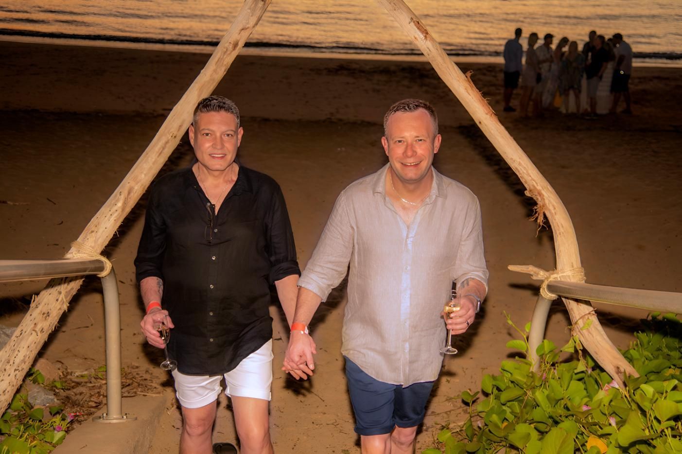 Two Men Holding Hands Walk Down Wooden — Up Here Photography in Rosebery, NT