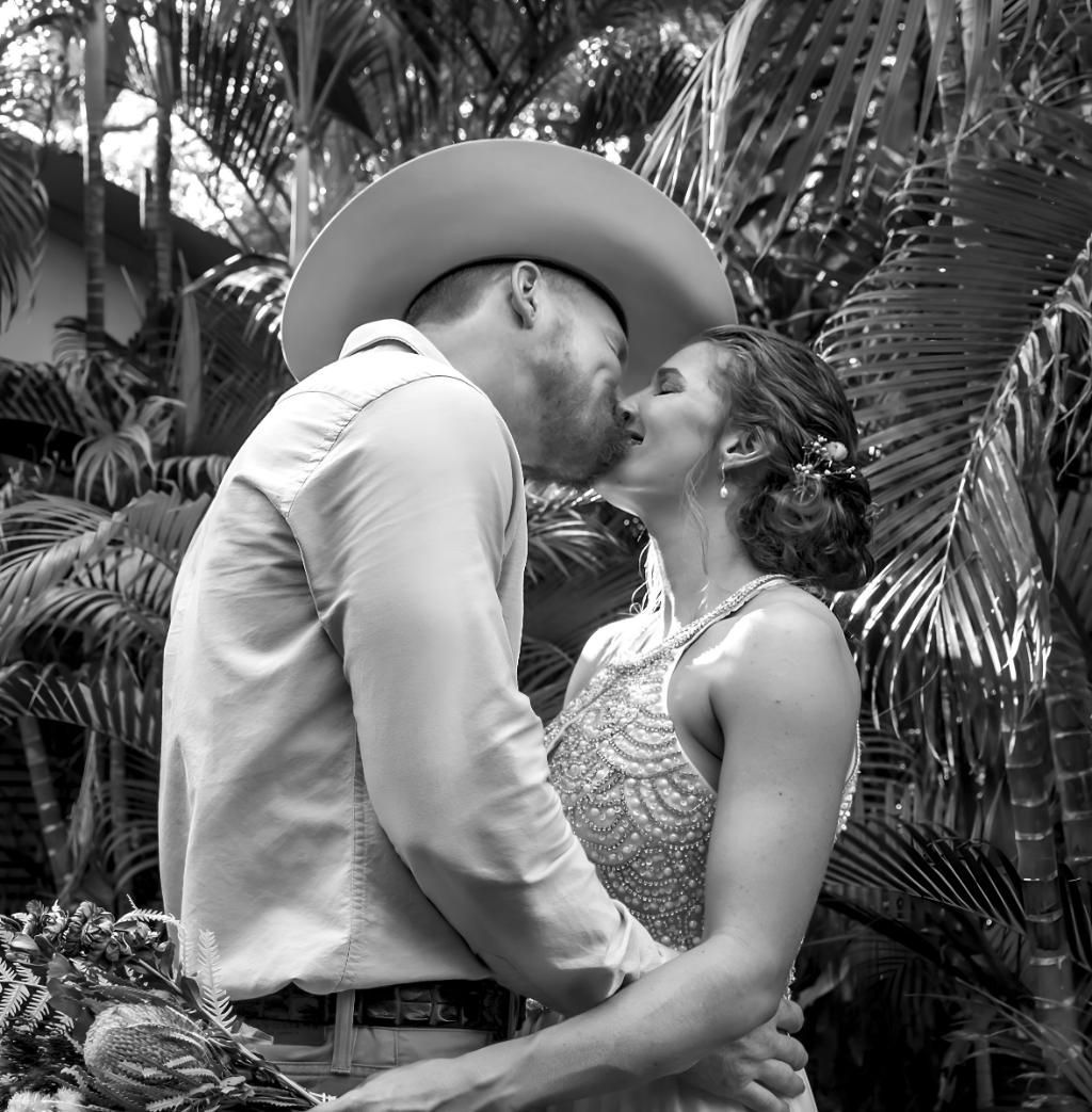 Bride and Groom Kissing Outdoors — Up Here Photography in Rosebery, NT