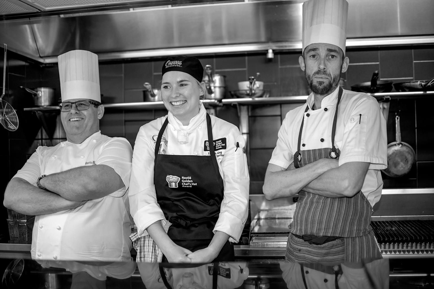 Three Chefs are Posing for a Photo and one of Them is Wearing a North Island Chef Hat — Photography in Darwin, NT