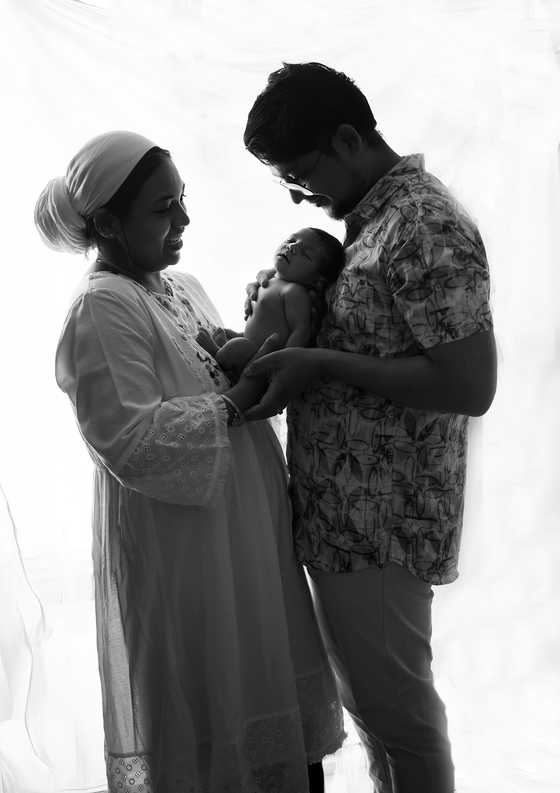 A Couple Holding A Baby - Photography in Darwin, NT