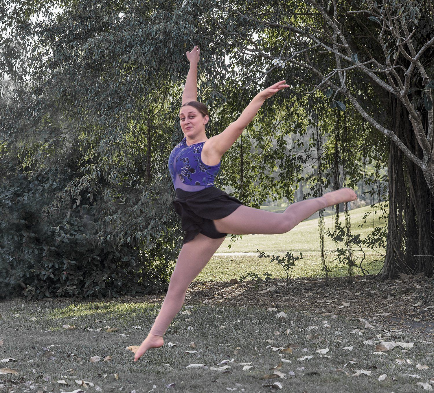 Dancer in a Blue Leotard and Black Skirt Leaps — Up Here Photography in Rosebery, NT