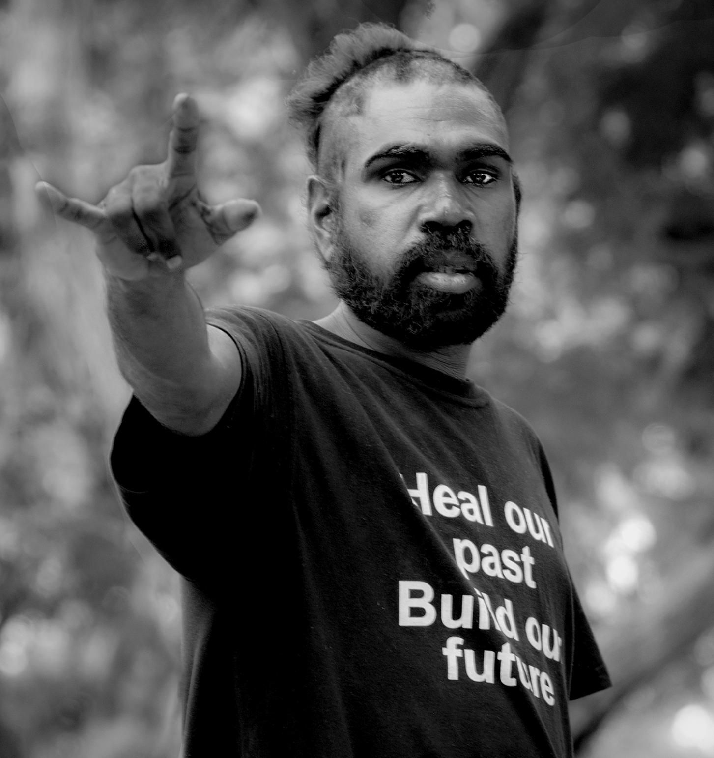A Man Wearing a Shirt That Says Heal our Past Build our Future — Photography in Darwin, NT
