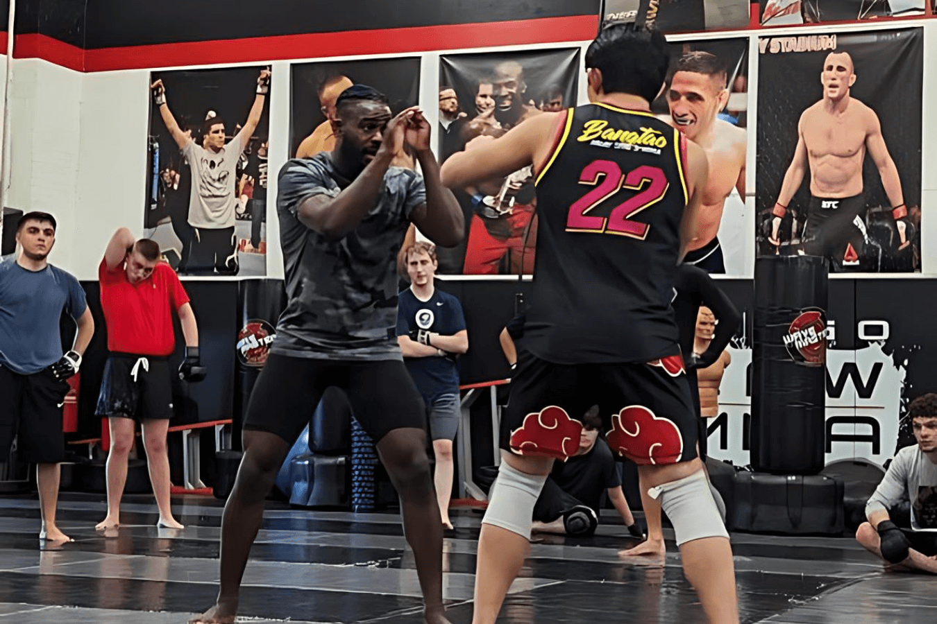 Adults training striking drills at Ray Longo's Mixed Martial Arts in Garden City, NY for stress relief and focus.