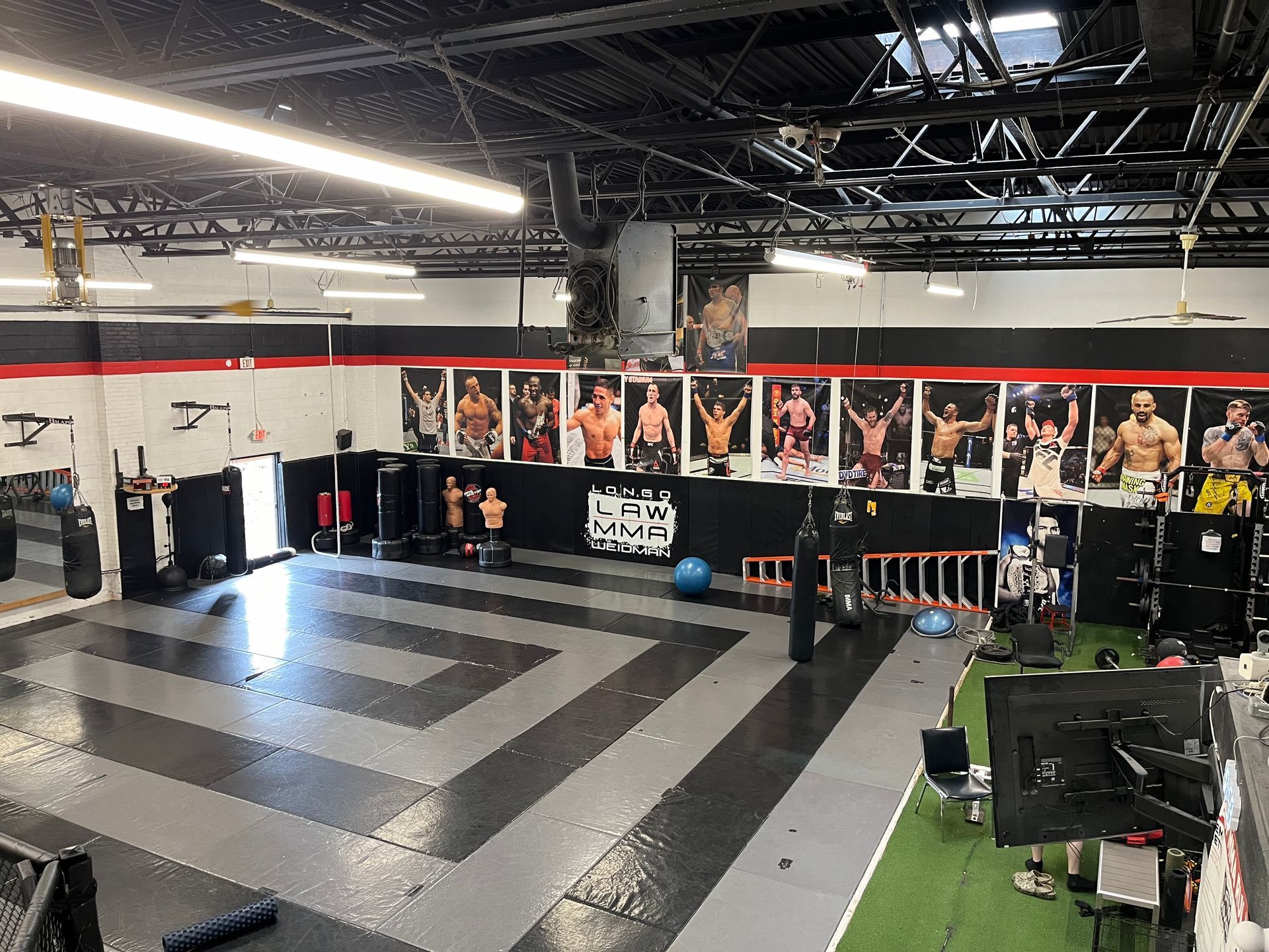 Family practicing partner drills at Ray Longo's Mixed Martial Arts in Garden City, NY.