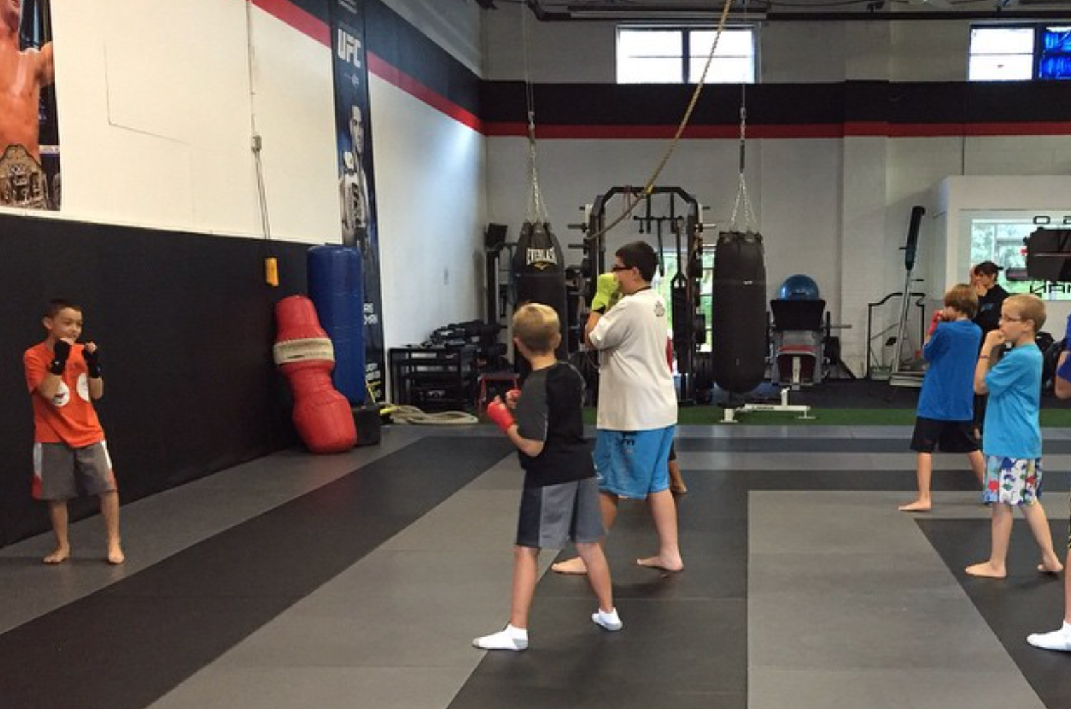 Kids practicing safe partner drills at Ray Longo's Mixed Martial Arts in Garden City, NY.