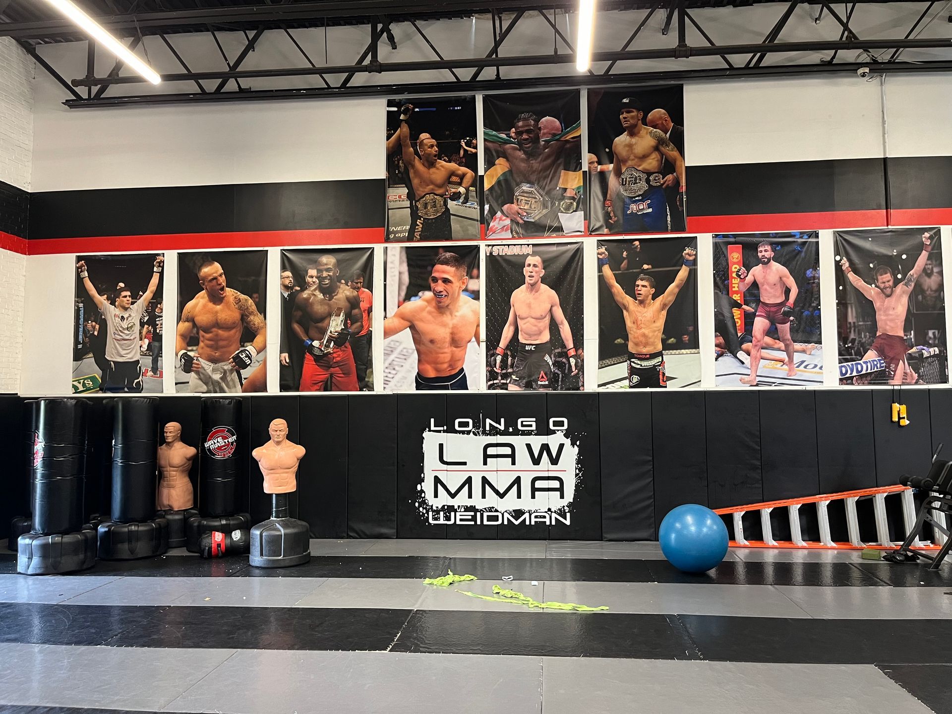 Students practicing MMA techniques at Ray Longo's Mixed Martial Arts gym in Garden City.
