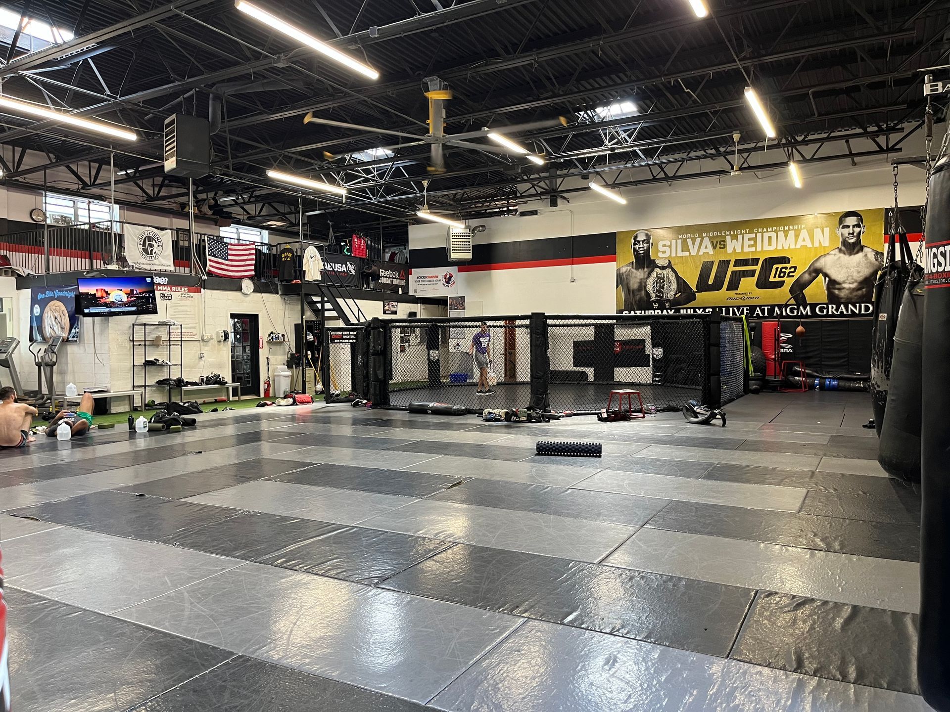 Adults train pads and footwork at Ray Longo's Mixed Martial Arts in Garden City, NY to boost fitness